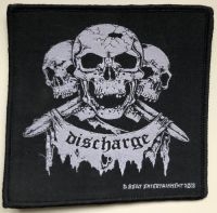 Discharge - Patch 3 Skulls (10,5 X 10,5 Cm) ryhmässä MERCHANDISE / Kangasmerkki / Pop-Rock @ Bengans Skivbutik AB (5577332)