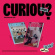 Unis - Curious (Photobook Ver.) (Random) Unis - Curious (Photobook Ver.) (Random)